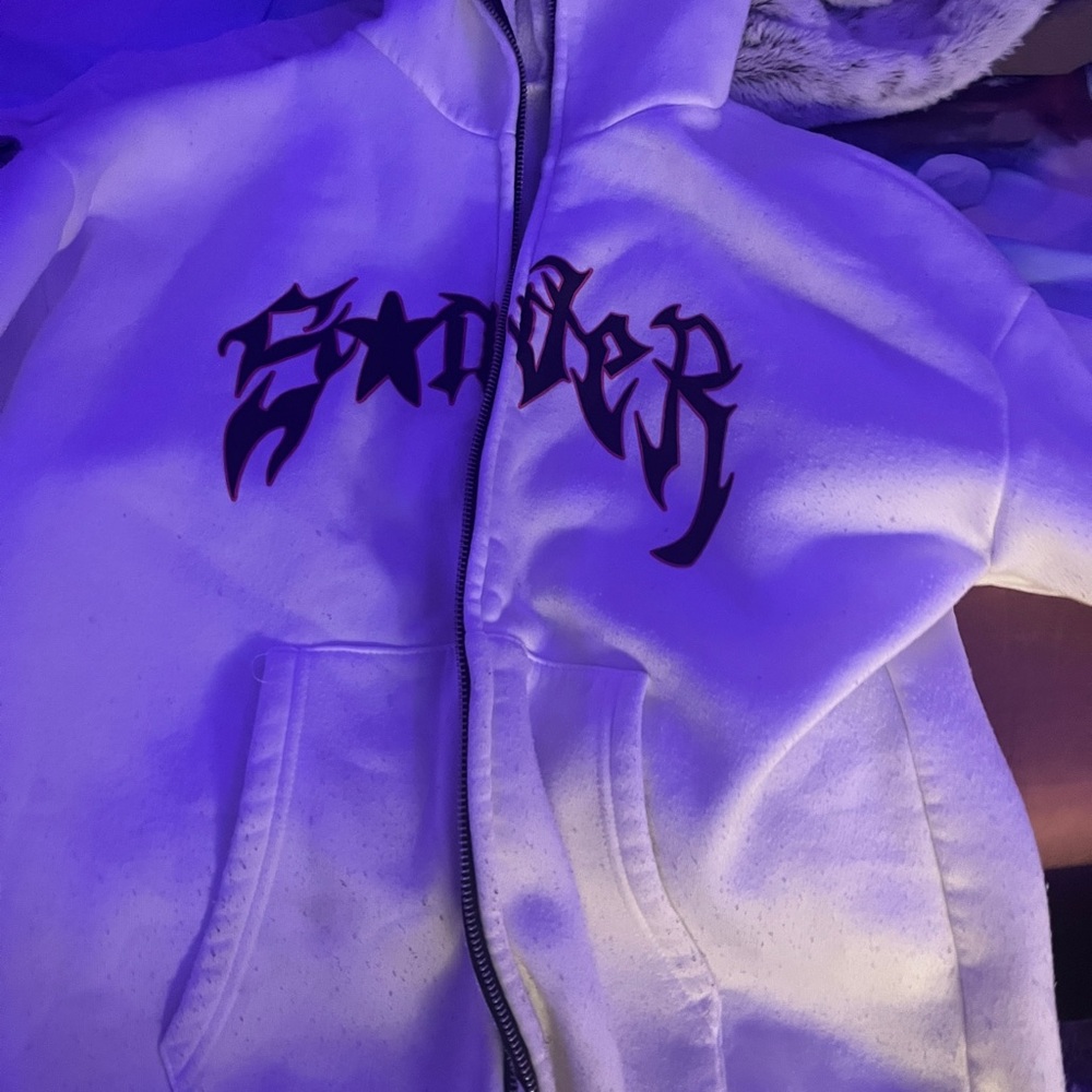 This is a pink and white hoodie, it’s in great condition